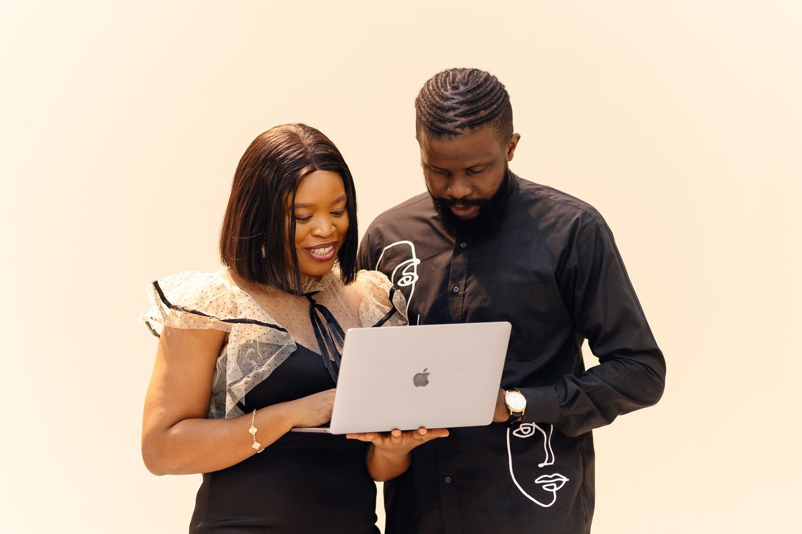 African colleagues reviewing a website on a laptop during maintenance planning