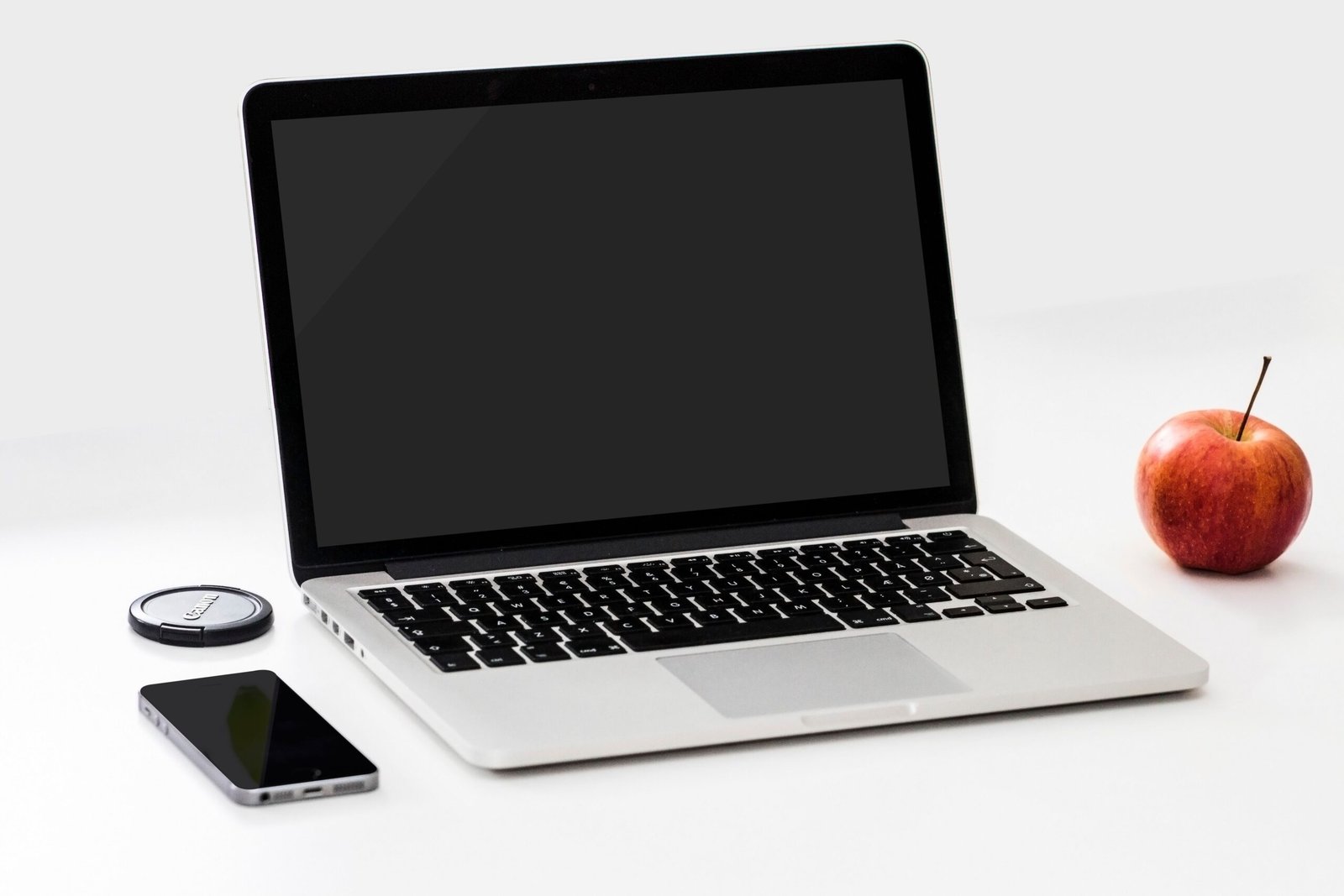 Clean workspace with laptop and smartphone used for professional website design