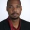 Formal portrait of a bearded African businessman
